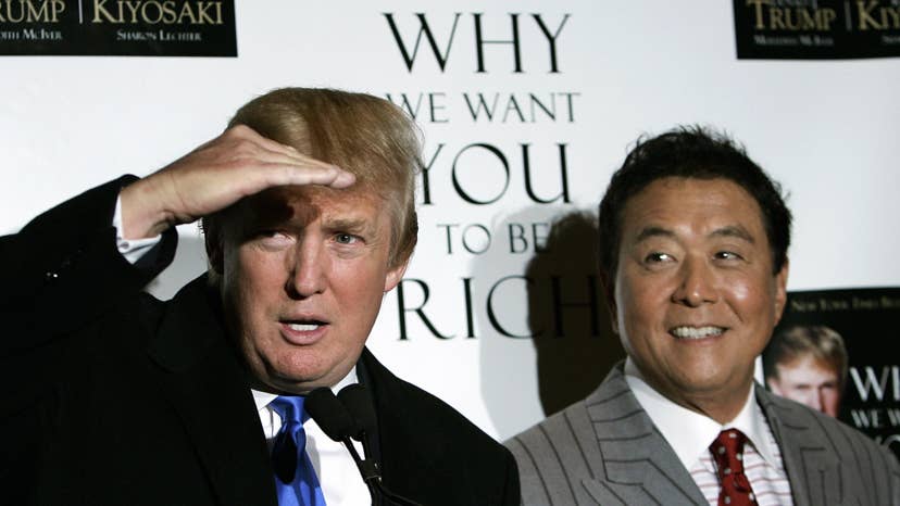 Donald Trump (L) and author Robert Kiyosaki hold a press conference at Trump Tower on 5th Avenue 12 October 2006 for a book launching party for their new book titled "Why We Want You To Be Rich - Two Men - One Message".