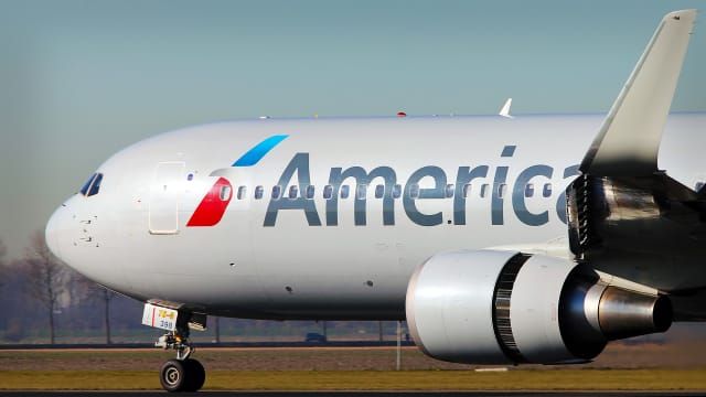 An American Airlines plane is seen on an airport tarmac. -lead