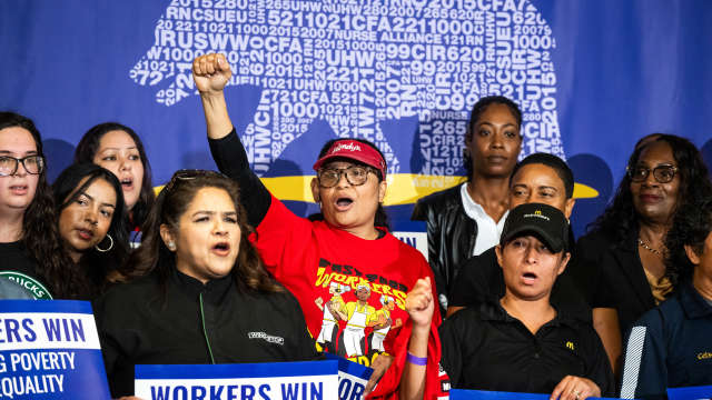 Fast food workers gather for Gov. Gavin Newsom's signing of legislation raising their minimum wage to $20 an hour in California at SEIU Local 721 in Los Angeles on Thursday, September 28, 2023.