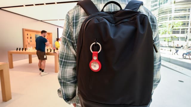 SYDNEY, AUSTRALIA - APRIL 30: A key ring containing an AirTag attached to a rucksack inside the Apple Store George Street on April 30, 2021 in Sydney, Australia. Apple's latest accessory, the AirTag is a small device that helps people keep track of belongings, using Apple's Find My network to locate lost items like keys, wallet, or a bag. (Photo by James D. Morgan/Getty Images)