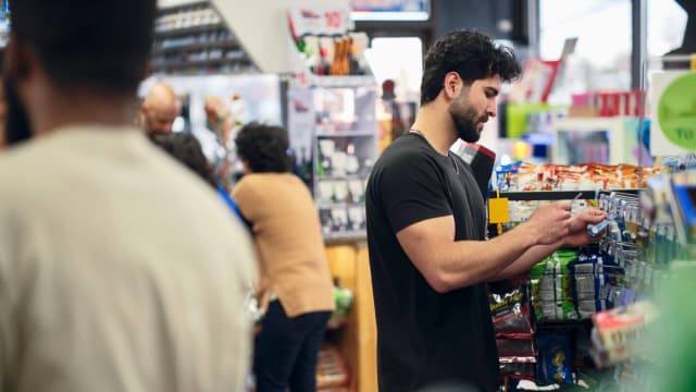 A man shops at a convenience store.