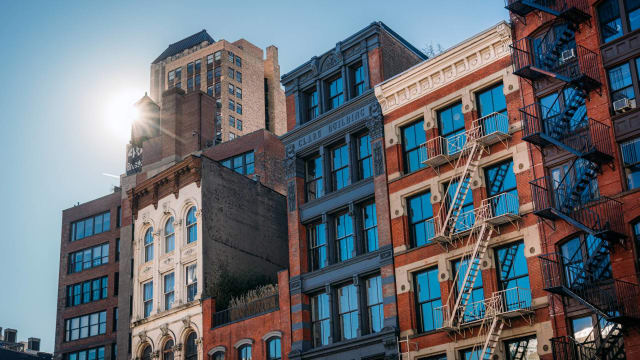 Urban Architecture with Historic Buildings and Fire Escapes in New York City. lead.