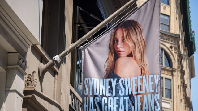 An advertisement featuring actress Sydney Sweeney outside an American Eagle store in New York, US, on Monday, Aug. 4, 2025. American Eagle Outfitters Inc. shares surged after US President Donald Trump came out in support of a controversial ad from the company featuring actress Sydney Sweeney.
