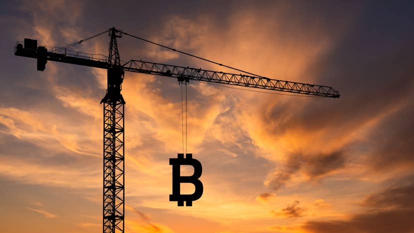 Construction crane with a Bitcoin sign