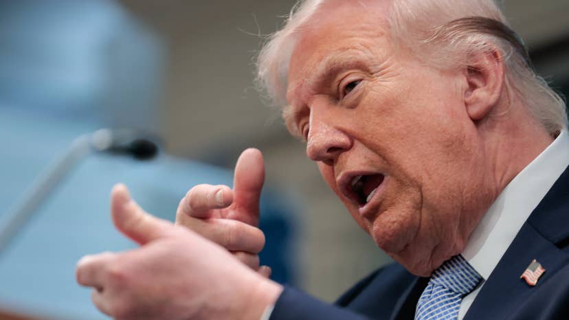 U.S. President Donald Trump mimics firing a gun as he speaks about the conflict in Iran at the White House on April 6, 2026, in Washington, DC.