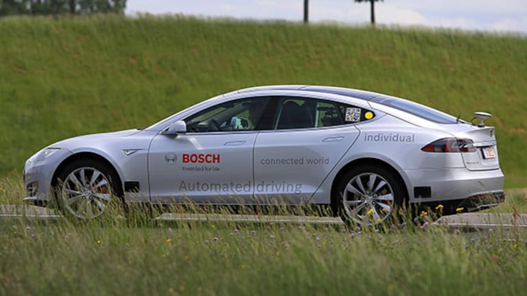 Tesla Goes on Autopilot -- but Don't Take Your Hands Off the Wheel