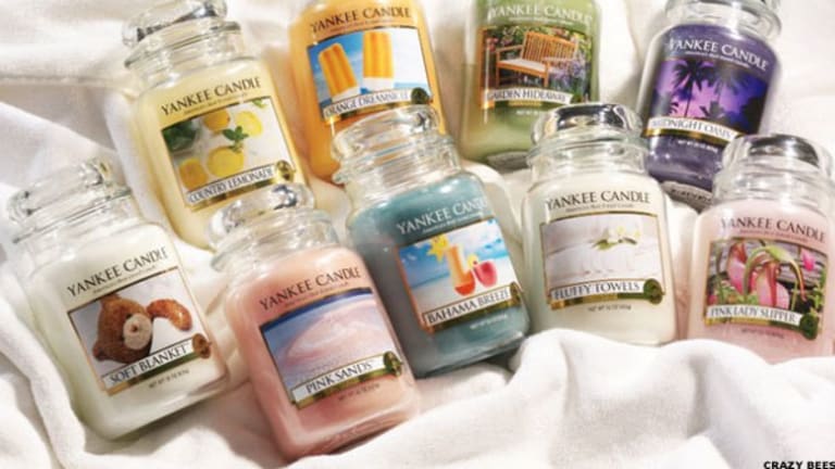 At Auction: 7 Yankee Candles- 1 used