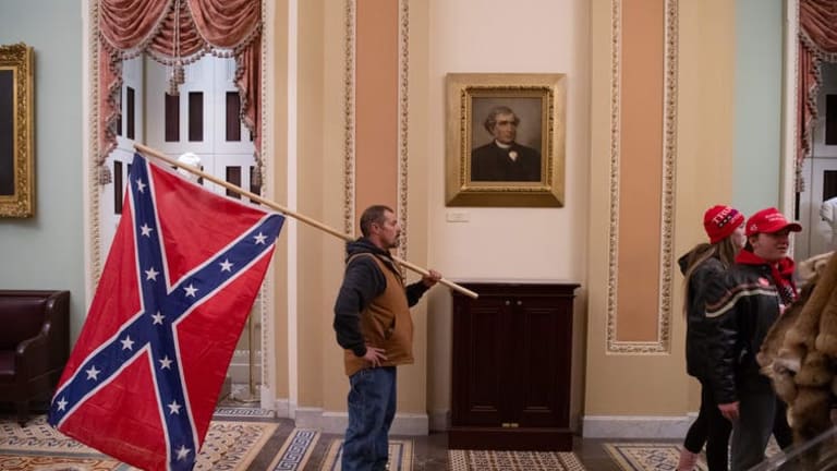 The Confederate battle flag, which rioters flew inside the US Capitol, has long been a symbol of white insurrection