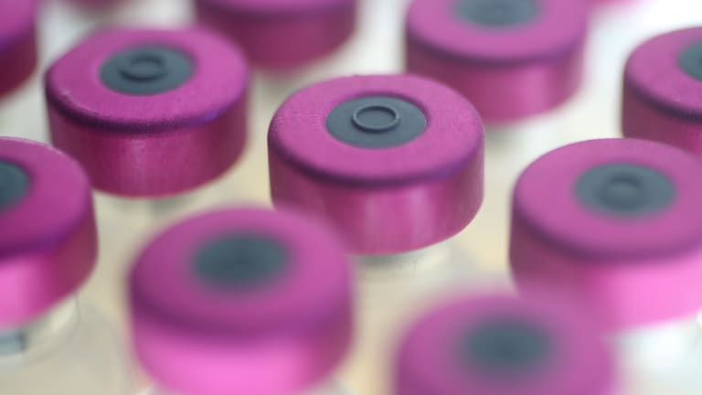 The Global Vaccine Race Against Time and Variants