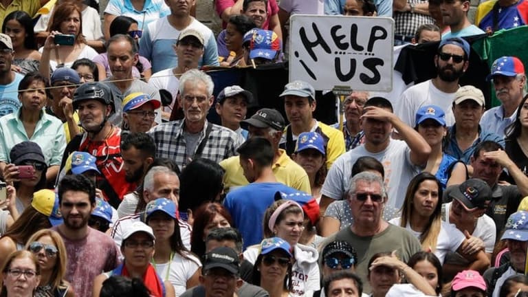 Venezuela’s power struggle reaches a tense stalemate, as human suffering deepens