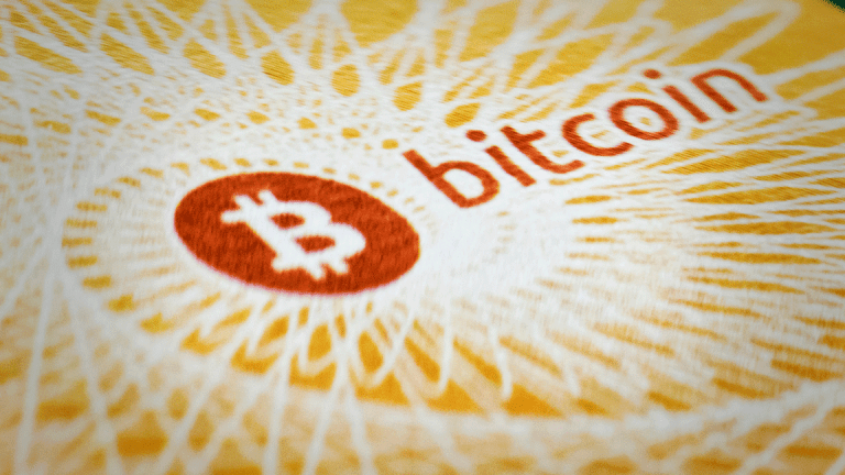 Bitcoin Futures Surge Triggers Two Trading Halts on Digital Currency Debut
