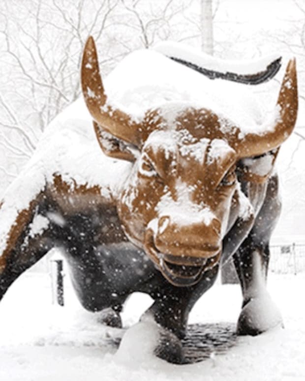 Charging bull in snow Wall Street