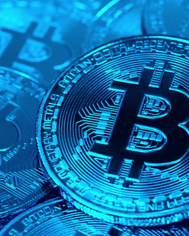 videoblocks-cryptocurrency-bitcoin-btc-bit-coins-rotates-in-blue-light-blockchain-technology-bitcoin-mining-concept-macro-shot-of-bitcoins_s_gjw4zmyf_1080__D