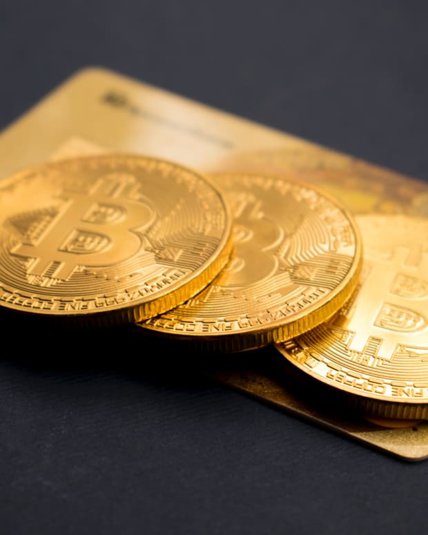 Golden Bitcoins on credit card.