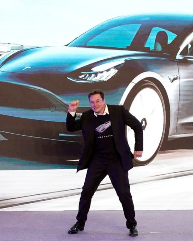 Tesla's chief executive Elon Musk doing a jig on stage during a delivery event of his company's China-made Model 3 electric cars in Shanghai on January 7, 2020. Photo: Reuters