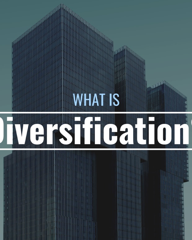 Darkened photo of a high-rise building with text overlay that reads "What Is Diversification?"