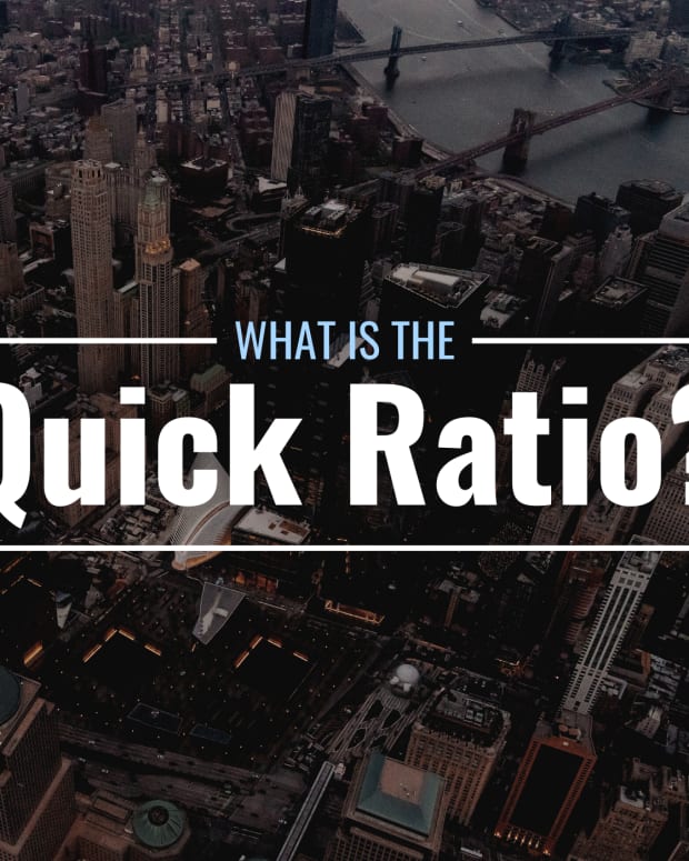 Darkened bird's-eye-view photo of New York City with text overlay that reads "What Is the Quick Ratio?"