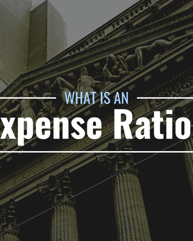 Darkened photo of the New York Stock Exchange with text overlay that reads "What Is an Expense Ratio?"