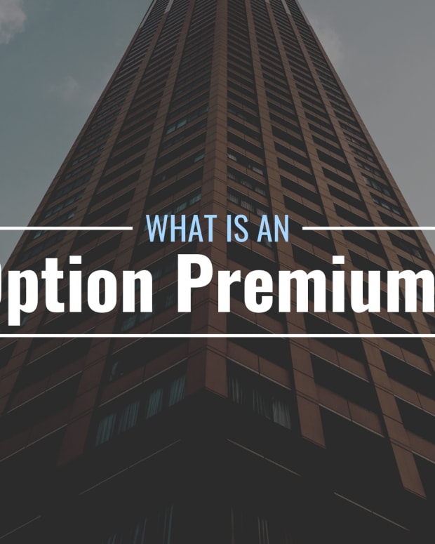 Darkened photo of a tall corporate/office building from below with text overlay that reads "What Is an Option Premium?"