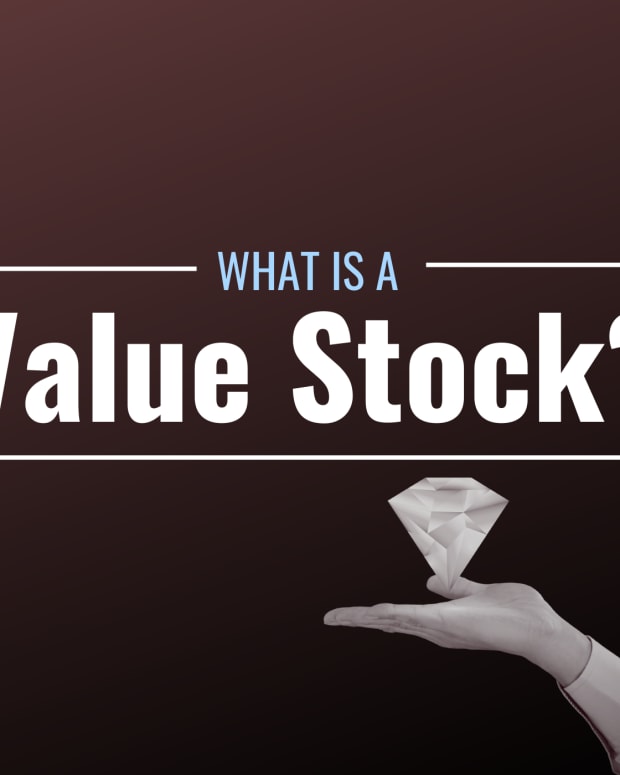 Image of a hand holding a diamond with the text overlay "What Is a Value Stock?"