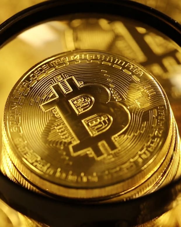 videoblocks-bitcoins-under-magnifying-glass-blockchain-technology-bitcoin-mining-concept-crypto-currency-gold-bitcoin-btc-bitcoins-and-loupe_hwg6v31ehm_1080__D