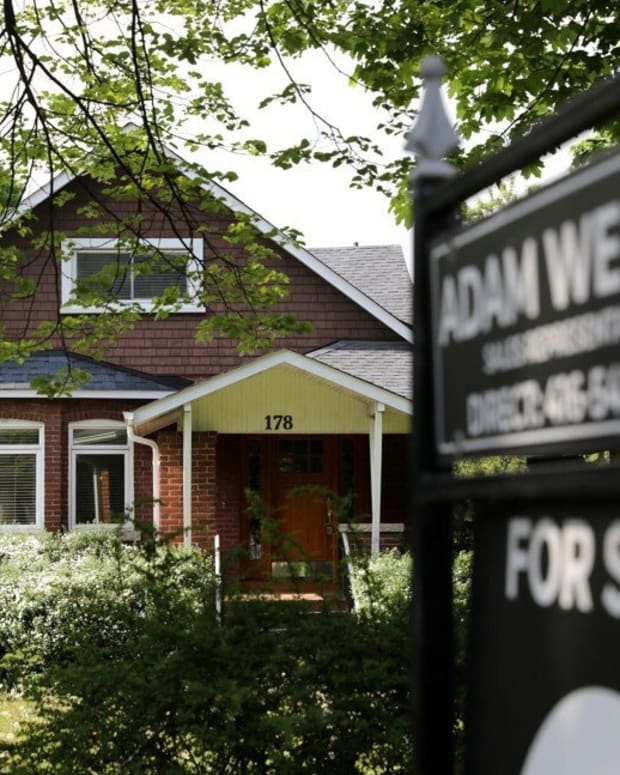 A realtor's sign outside a house for sale in Toronto on May 20, 2021. Photo: Reuters.