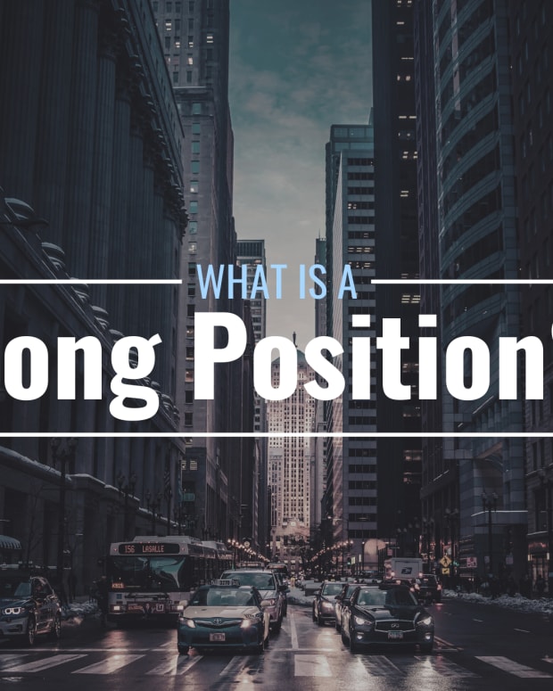 Darkened photo of oncoming cars and tall buildings on a crowded city street with text overlay that reads "What Is a Long Position?"