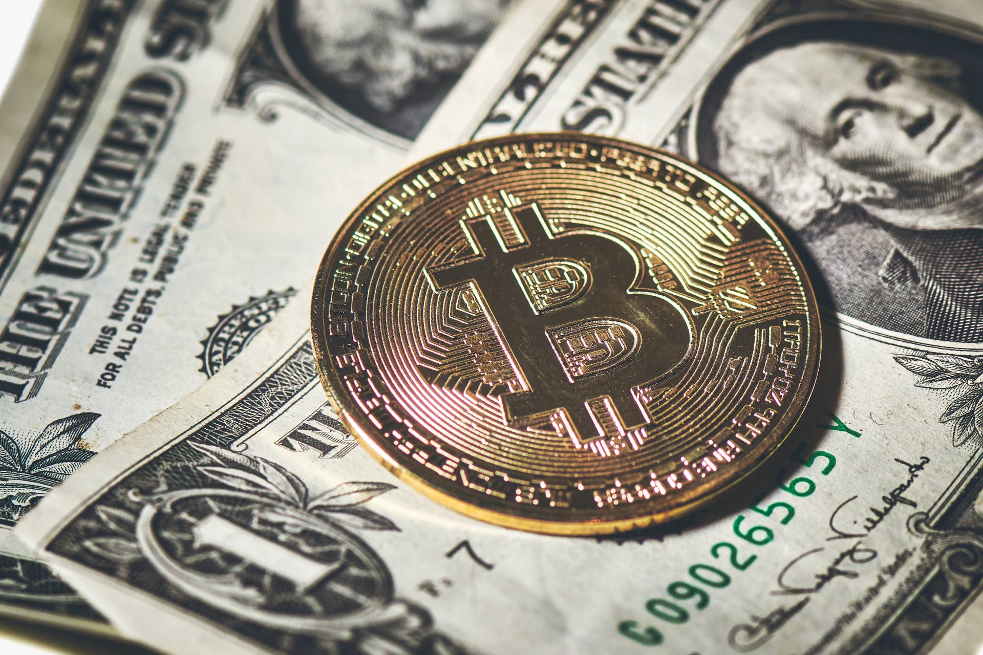 bitcoin-coin-resting-to-paper-dollars-2023-11-27-04-58-21-utc