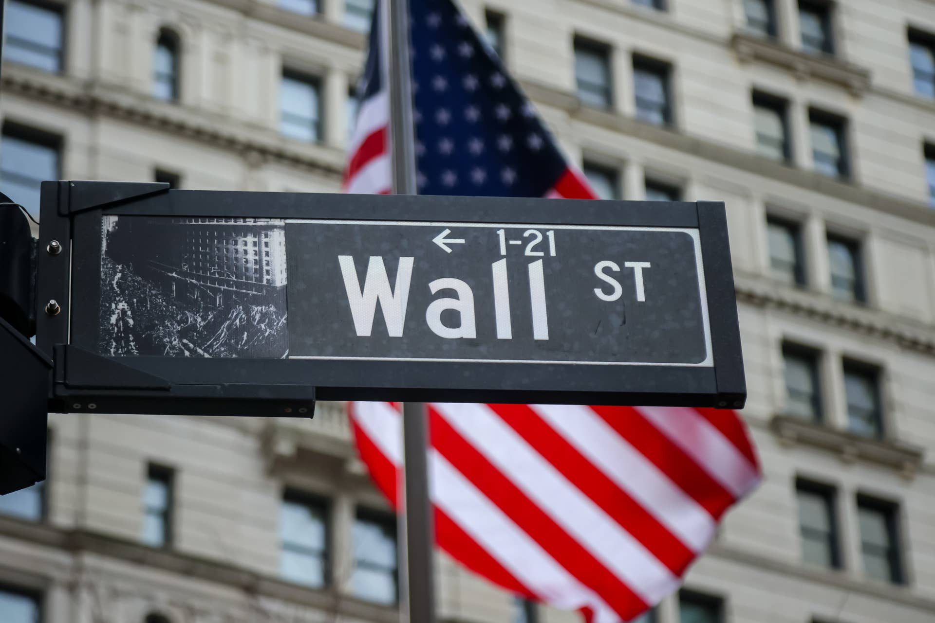 A Wall Street street sign near the New York Stock Exchange (NYSE) in New York, US, on Monday, Dec. 8, 2025. 