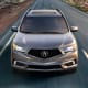 Acura MDXStarts at: $44,300MPG: Up to 20 city / 27 highwayThe MDX is a three-row SUV with a standard 3.5-liter V6 engine or an optional gas-electric hybrid with a 3.0-liter V6.Photo: Acura