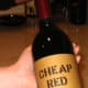 For those ready to go (slightly) higher-end, there is a label of wine literally called "Cheap Red Wine." It is sold at many liquor stores, and also online at Hops &amp; Grapes for $5.98 per bottle. The wine describes itself&nbsp;thusly: "Our red table wine is a premium blend of varietal grapes. It is an honest, well made wine. We recommend it as an excellent everyday wine...that can also rise to the occasion." I've actually had a bottle of Cheap Red Wine before (it was a gift) and was not terribly impressed. If you're going to drop $6 on wine, you might as well spend a little bit more (around 99 cents more) and invest in a fruity, delicious Yellowtail Shiraz. The Australian Yellowtail brand has its own fiercely loyal group of frugal drinkers. Photo Credit: Ryan Gessner