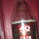 Olde English is an ultra low budget "forty ounce" malt liquor beverage. It is&nbsp;made by Miller Brewing Company. The brand is enjoyed by under-age drinkers (so we hear) and by college students at raucous parties... even though it is dirt cheap and has a questionable flavor profile, it knows no economic boundaries: Harvard trust funders and G.E.D. pharmacy store night-shifters are equally likely to enjoy an Olde English-fueled game of "beer pong" into the wee hours of the morning. Drinking it is something of a rite of passage. An amateur&nbsp;reviewer wrote: "Made me puke on first sip. [...] This was absolutely vile." But still, for $1.75, you can't expect too much. Photo Credit: whatshername