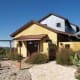 Although straw bale building techniques are most often seen in the mid- and western portions of the U.S., it’s not uncommon to find them in the south. Eight miles out of the artist mecca of Eureka Springs, Ark., sits a straw built, solar powered home on 12 acres with an asking price of $295,000.