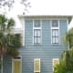 A two-story, Charleston-style cottage with 1,578 square feet of interior space and 750 square feet of decks and wide covered porches is currently listed at $999,000. The three bedrooms, each with a private bathroom, are located on the ground floor while the living, dining and kitchen areas plus an additional bathroom occupy the second floor in order to take advantage of the light and views of the Gulf. The interiors are light and airy with high ceilings, dark stained hardwood floors and interior shutters for modulating light and privacy. Photo Credit: Patrica Norrell(850)699-7637