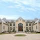 The housing market may have taken a tumble in 2008 and 2009, but that hasn’t stopped the super rich from building brand new supersized homes. Case in point: A 24,000 square-foot monster manse in the Chicago suburb of Northfield that is currently listed at $5.5 million. The almost new, faux-French Normandy-style house encompasses 24 rooms including seven bedrooms, seven full and three half bathrooms, a train station-sized entrance hall with inlaid marble floors and what listing information calls a “bridal staircase.” Photo Credit: Sharon Friedman / Coldwell Banker–Winnetka South