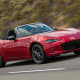 Starting price: $24,915Miles per gallon equivalent: 27 city, 36 highway, 31.5 combinedThe Miata is every bit the same powerhouse as the Porsche Boxster it competes against.O.K., so the engine is is a little pokier at 155-horsepower from a 2-liter, 4-cylinder -- no matter which trim you pay for. That said, the two cars have similar acceleration (zero to 60 in 6.5 seconds for the Porsche, 7&nbsp;seconds for the Miata), similar ratings from Consumer Reports (90 for Porsche, 89 for Mazda) and similar customer satisfaction. The Miata's available hardtop that kicks the starting price up above $27,000 only closes the gap further.Redesigned this year with lower ground clearance than ever and with musclebound, stingray-style curves, the Miata is also 148-pounds lighter. That's great for its mileage and for the addition of perks like a Mazda Connect touchscreen and communications system, but it also makes that engine feel almost Porsche fast.