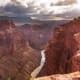 Grand Canyon National Park encompasses 277 miles of the Colorado River. The immense canyon is a mile deep and up to 18 miles wide. Layered bands of colorful rock reveal millions of years of geologic history. Nearly 6 million people visit this famous park annually.