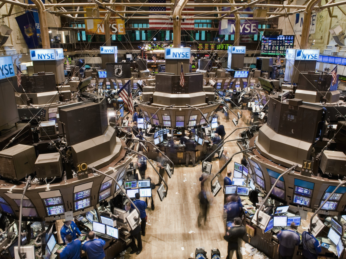https://www.thestreet.com/.image/c_fill%2Cw_1200%2Ch_900%2Cg_faces%3Acenter/NDA6MDAwMDAwMDAyODk5MDY5/an-aerial-view-of-the-new-york-stock-exchanges-trading-floor-since-the-installation-of-the-hybrid-market-system-in-2007-there-has-been-less-traders-on-the-floor-due-to-an-increase-of-electronically-do.jpg