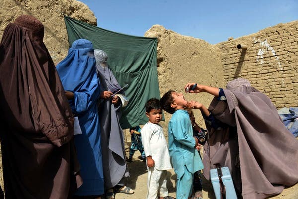 An Afghan health worker administers the polio vaccine to a child in Arghandab, Afghanistan, Aug. 17, 2018. Javed Tanveer/AFP via Getty Images