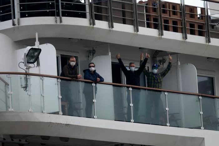 Every passenger aboard the Greg Mortimer, a cruise ship bound for Antarctica, was given a surgical face mask. AP Photo/Matilde Campodonico