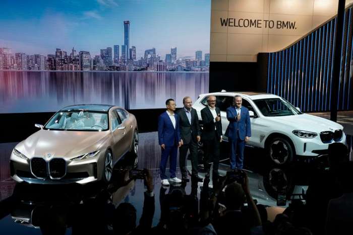 BMW executives in Beijing at the unveiling of new electric luxury cars at the Auto China 2020 show. AP Photo/Ng Han Guan