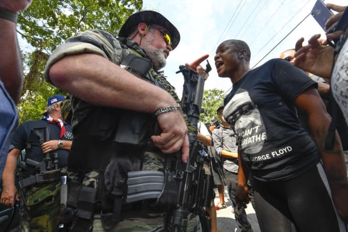 Opposing demonstrators face off in the town of Stone Mountain, Georgia, on August 15 2020. Far-right groups rallied there in ‘defence’ of the Confederate Memorial Carving, built in the 1960s to commemorate Confederate leaders, John Amis/EPA