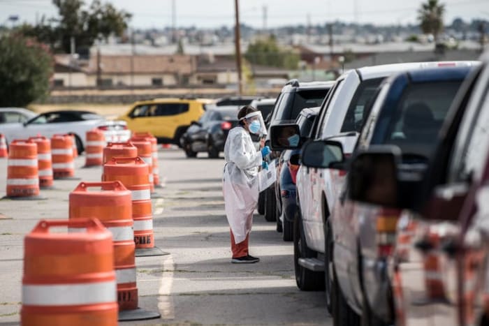 People wait in their cars at a coronavirus testing site in El Paso, Texas, that has reported record numbers of active coronavirus cases. Cengiz Yar/Getty Images
