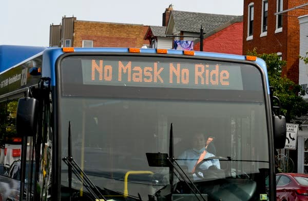 A bus reminds people ‘No Masks No Ride’ in September 2020. Ben Hasty/MediaNews Group/Reading Eagle via Getty Images