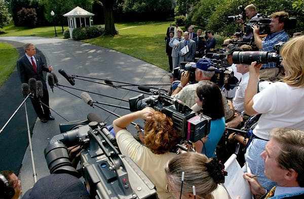 President George W. Bush, left, announces he will sign over the power of the presidency temporarily to Vice President Dick Cheney while he undergoes a colonoscopy. Tim Sloan/AFP/Getty Images