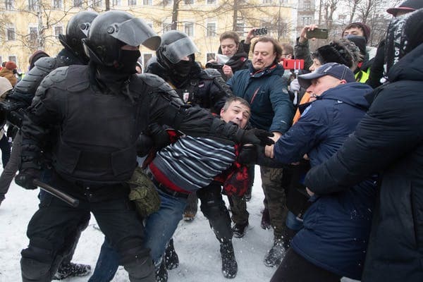 Riot police officers detain a man during a rally in support of jailed Russian opposition leader Alexei Navalny in Saint Petersburg, Russia, on Jan. 31. Anatolij Medved/NurPhoto via Getty Images