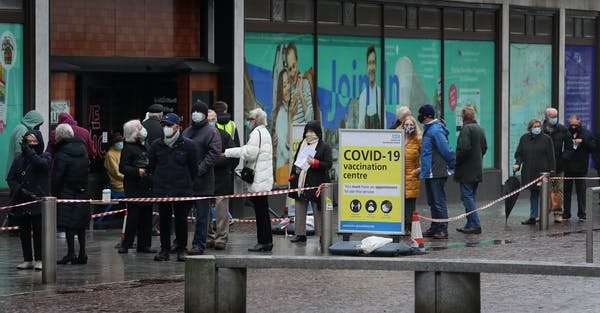 People wait for a COVID-19 vaccine during England’s third national lockdown to curb the spread of coronavirus. Gareth Fuller/PA Images via Getty Images