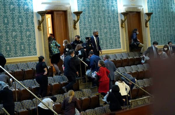Members of Congress evacuating the House as it was being attacked by protesters. Drew Angerer/Getty Images via Getty Images