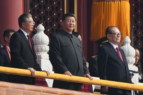 Chinese President Xi Jinping attends a military parade with former Presidents Hu Jintao, left, and Jiang Zemin in Tiananmen Square in Beijing on Oct. 1, 2019. Greg Baker/AFP via Getty Images