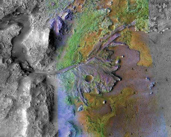 This color–enhanced photo shows the ancient river delta in the Jezero Crater where Perseverance will look for signs of life. NASA/JPL/JHU-APL/MSSS/Brown University
